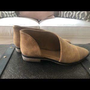 Tan flat booties with side cutouts